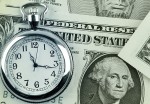 Stopwatch and dollar bills.
