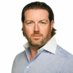 Headshot of Adam Spencer